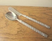 Torsade stainless pattern by Orleans. Sugar spoon and butter knife. Torsade stainless flatware pattern by Orleans.