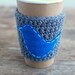 Coffee sleeve, gray with blue bird by The Cozy Project