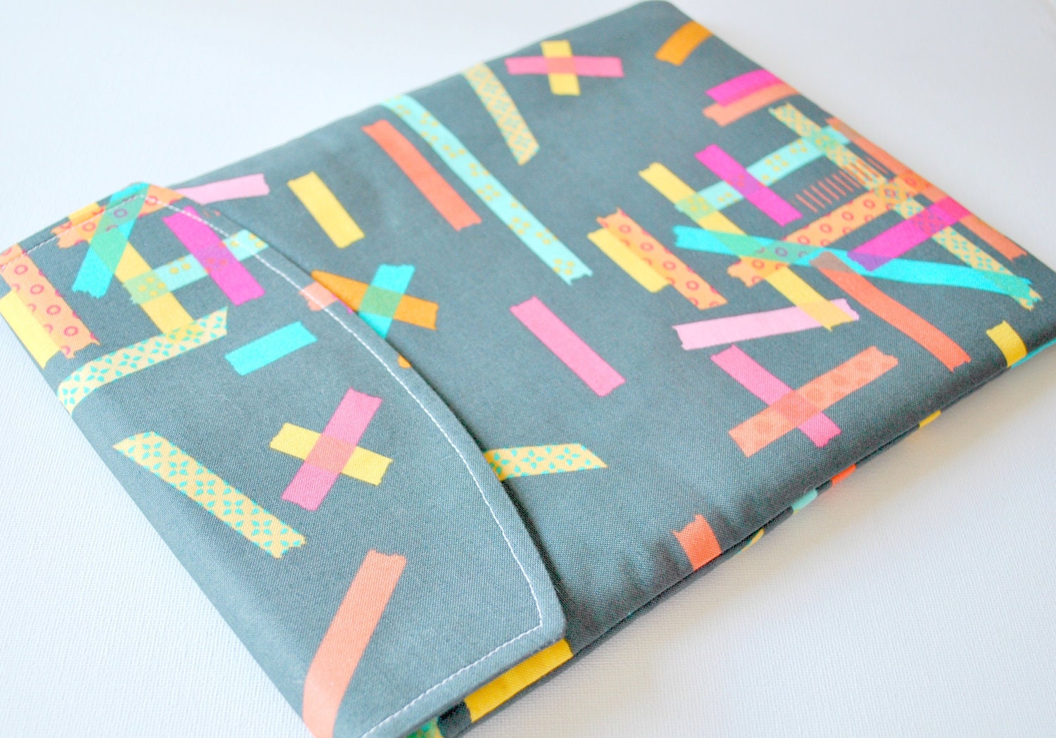 iPad padded gadget pouch: Modern washi tape print sleeve with flap.