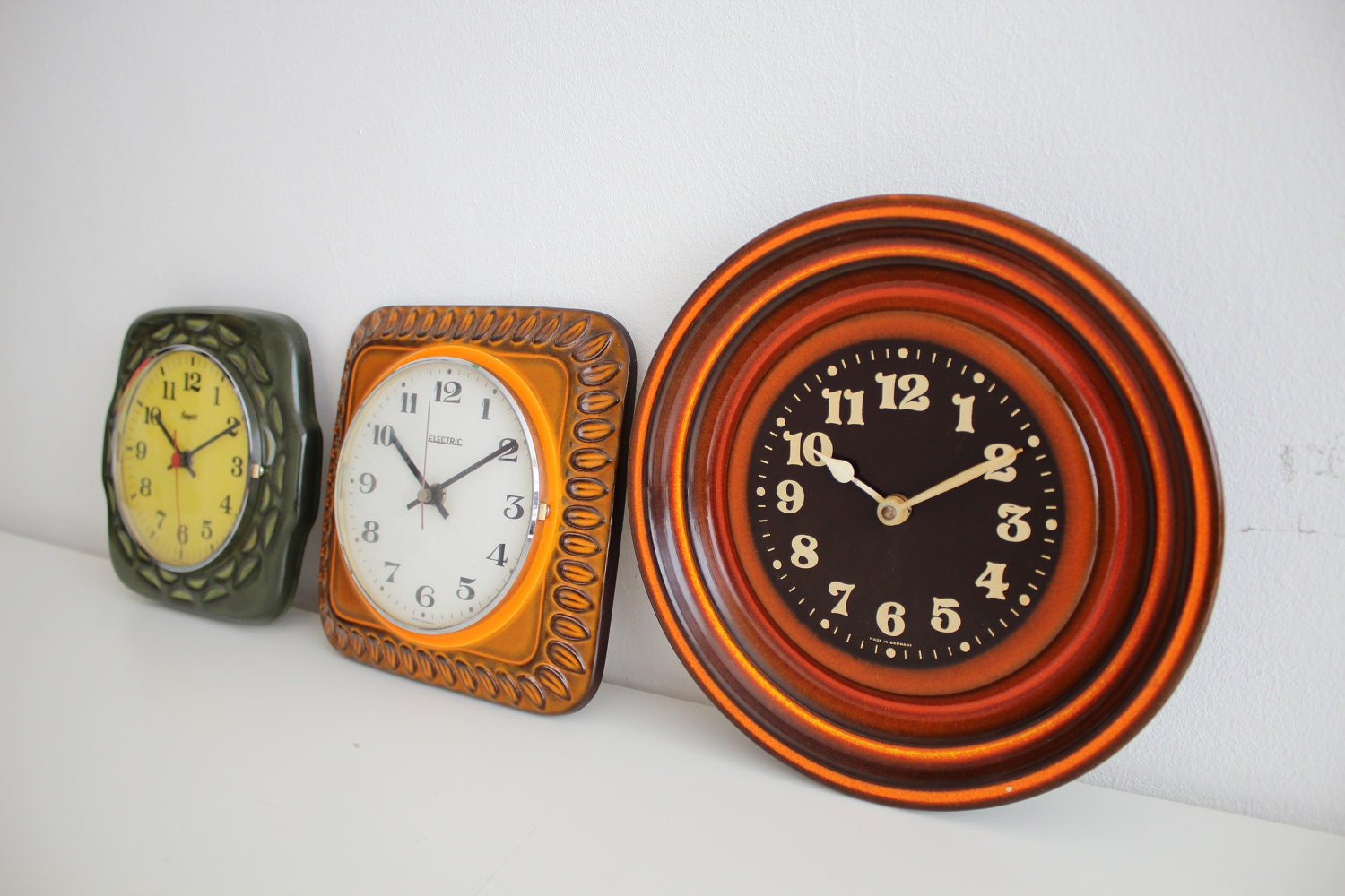 3 Vintage Ceramic orange/brown/green 70's Electric wall clocks made in West Germany