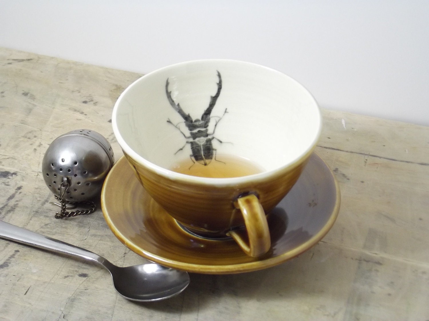 Porcelain Dark Amber Stag Beetle Tea Cup and Saucer - FaithAdamsCeramics