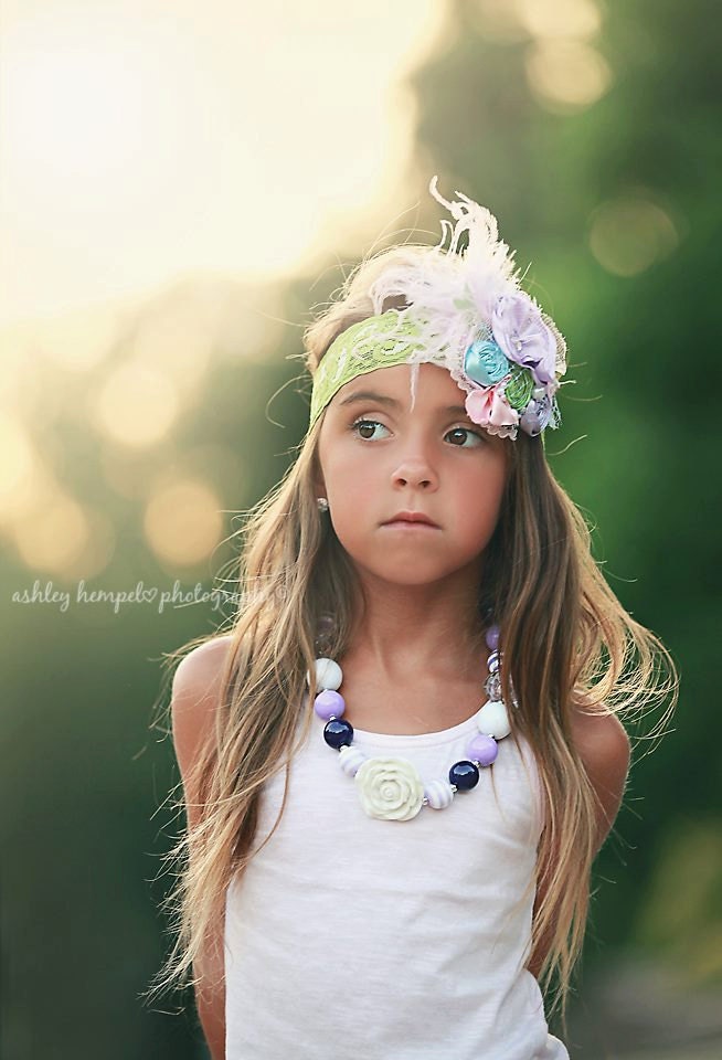 Lavender fields is a chunky necklace with shades of purple beads and flower pendant