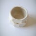 white and gold faceted bud vase