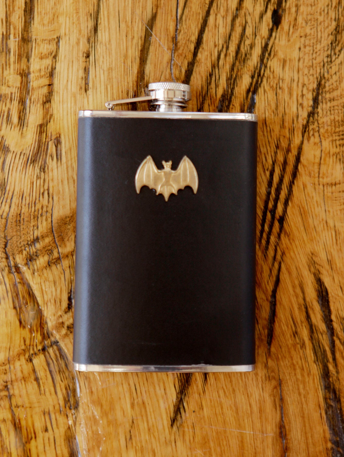 brass bat flask. beautiful black leather wrapped stainless steel flask. great gift.