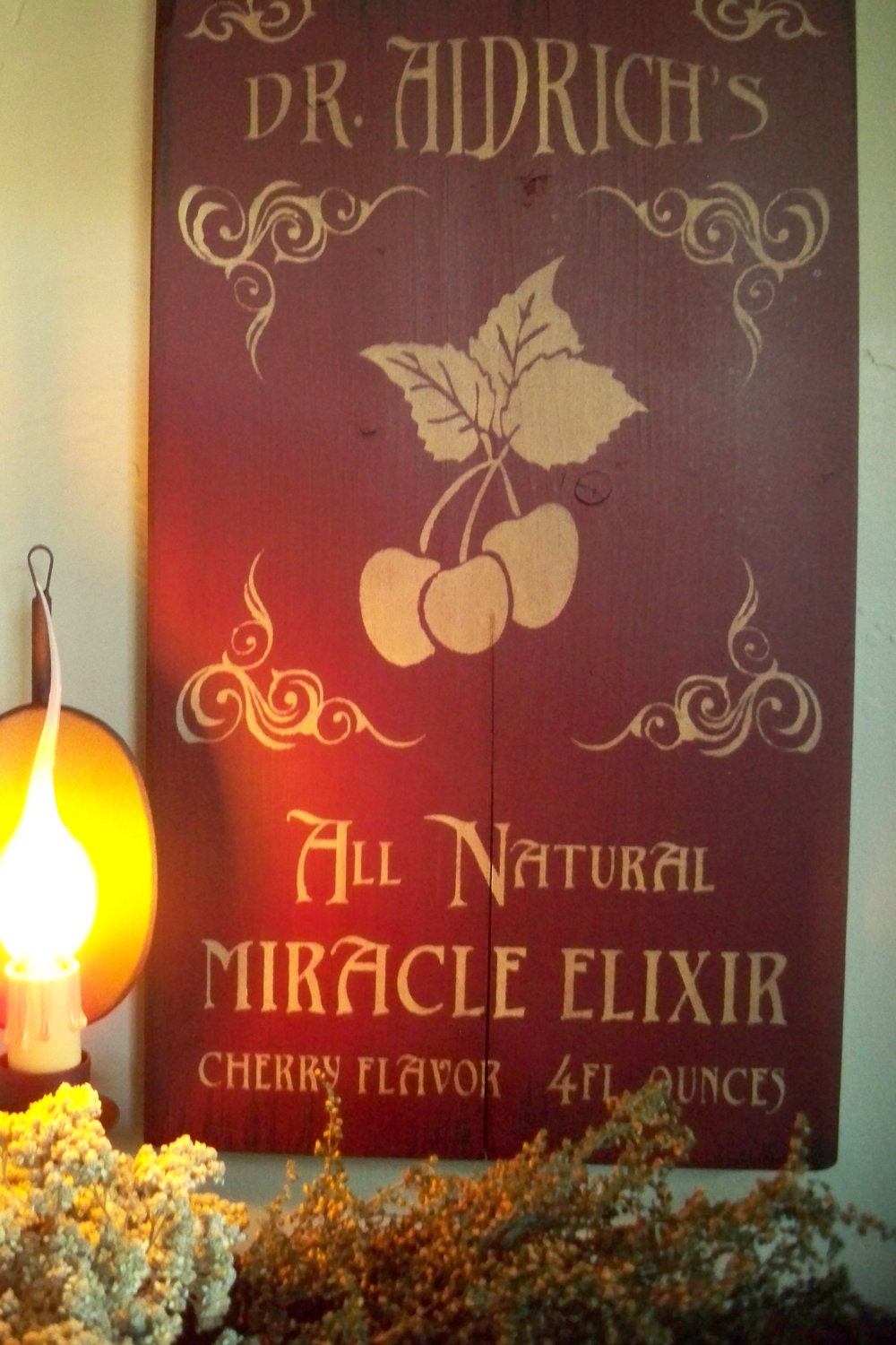 Antique style medicine advertisement sign elixir apothecary cherry flavor primitive rustic old west doctor medicine
