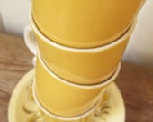 Set of Four Mustard Yellow Cups and Saucers