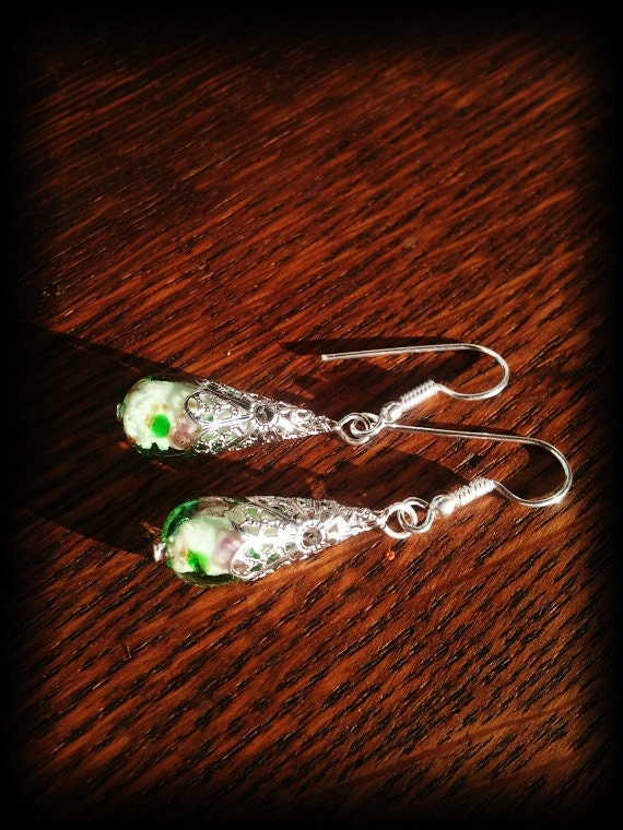 green flower lampwork glass silvertone earrings with white copper earwires