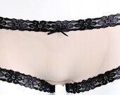 Nude mesh panties with black lace.