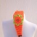 Orange Hand Knitted Headband Ear Warmer with Crochet Flower