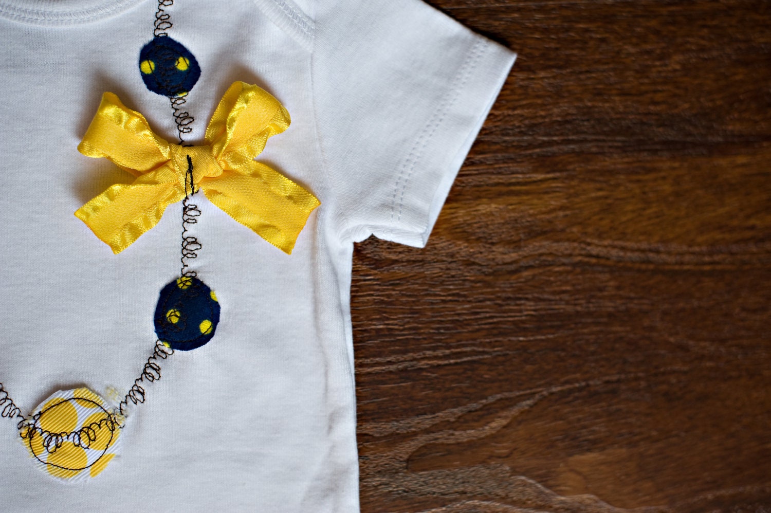 Swanky Baby Girl Wolverine "Necklace" Onesie In Michigan Wolverine Colors