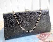 Black Textured Clutch Chain Handle Purse.