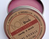 The Bondle: 6 oz Sweet Spiral Christmas Soy Candle flavored with Candy & Mint in a Seamless Tin