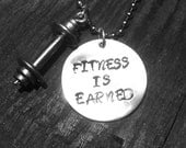 FITNESS IS EARNED silver with pewter barbell... Crossfit workout