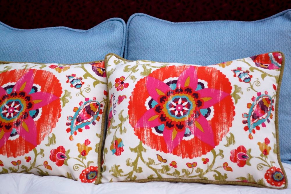 Bright Suzanni Pillow Shams with Green Ochre Piping and Reversible Cream Matelasse Back