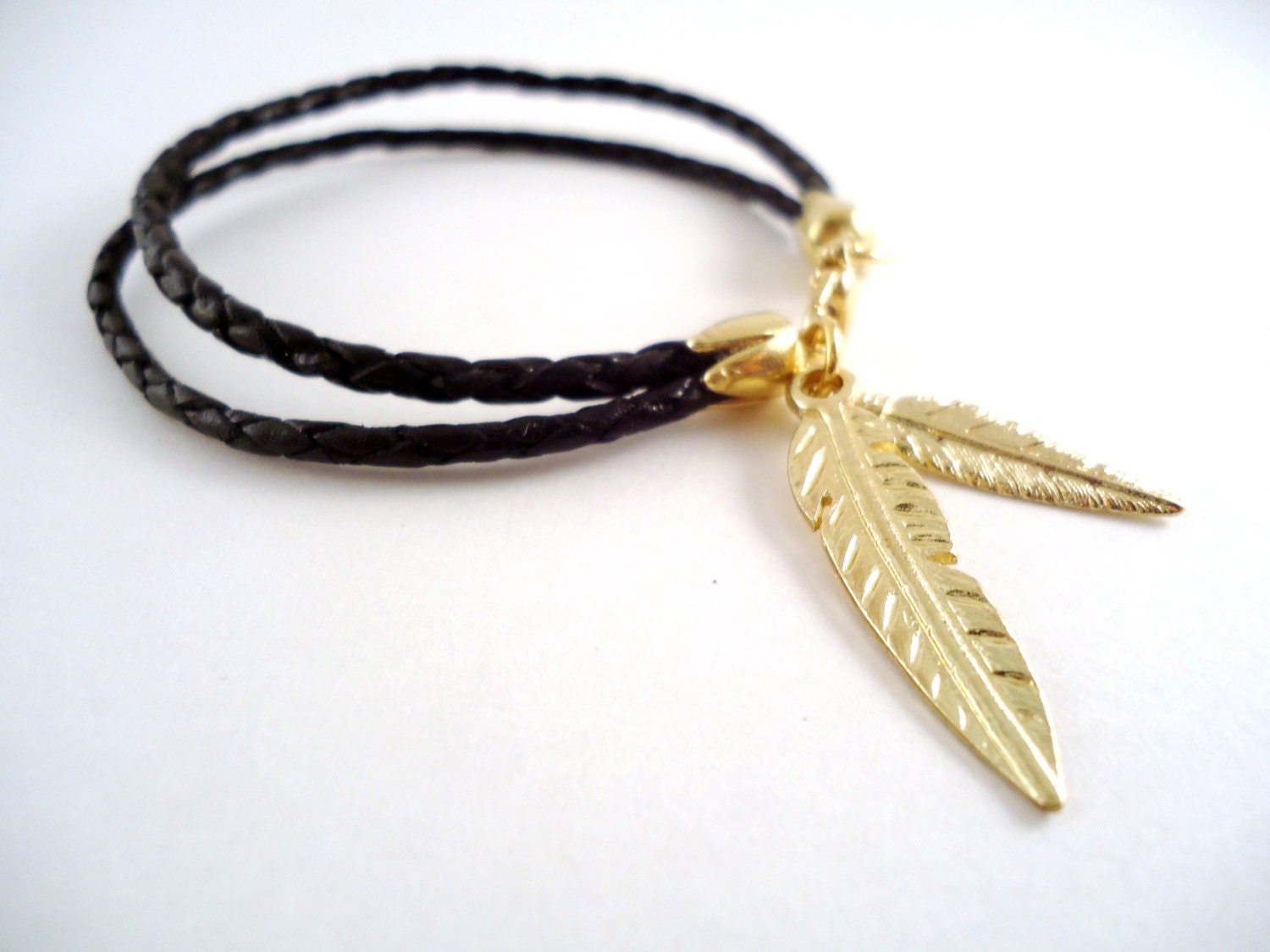 Beautiful black braided bolo leather double gold feather charm bracelet