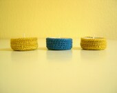Tea candles with crocheted cozies