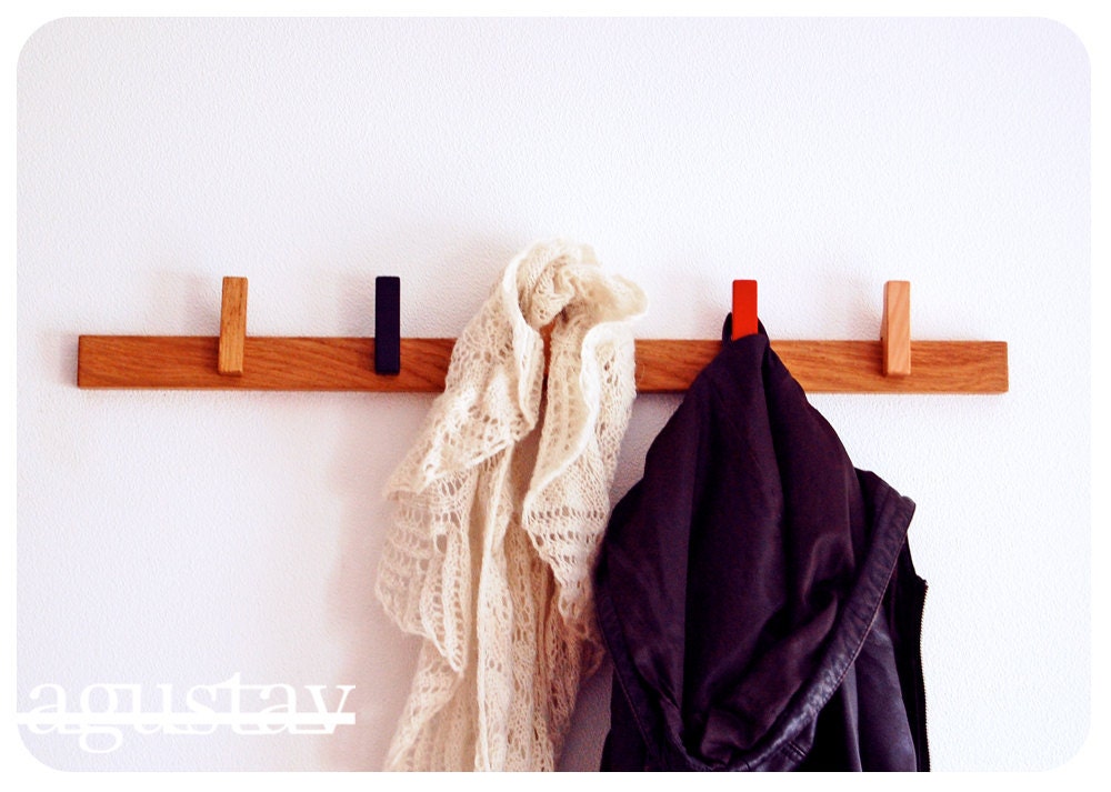Custom made wooden coat rack. Movable pins. Can be customized to fit every room of the house.