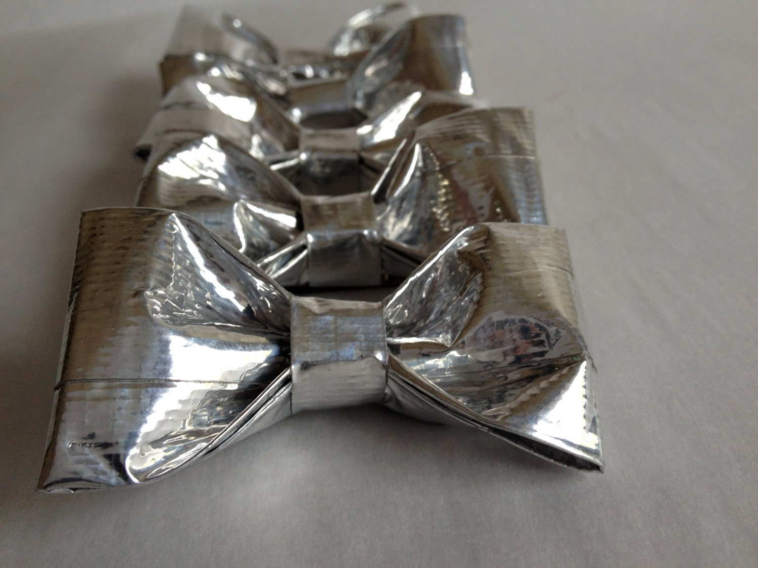5, 2' Duct Tape Hair Bows. Backed with alligator clip.