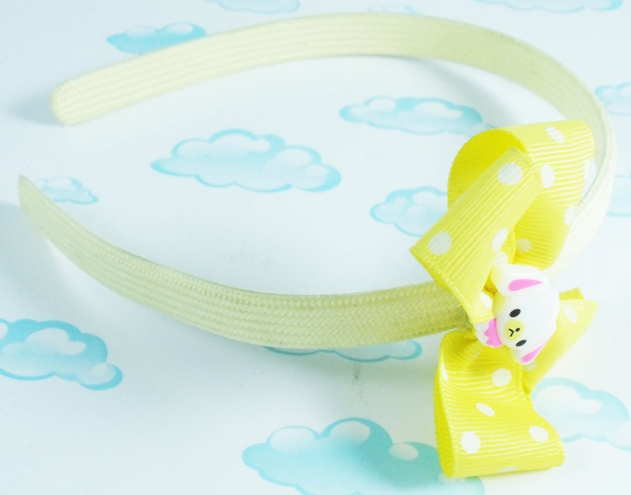 Headband Yellow cloth covered plastic headband with yellow polka dot puppy bow