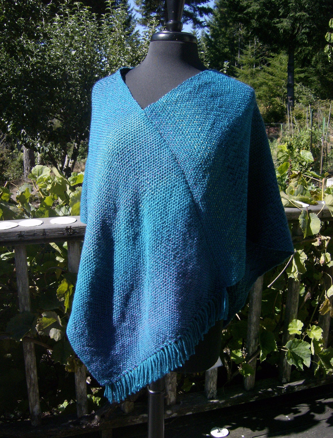 Hand woven poncho inspired by the Wild Rivers Coast.