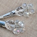 Crystal and silver dangly chandelier earrings.