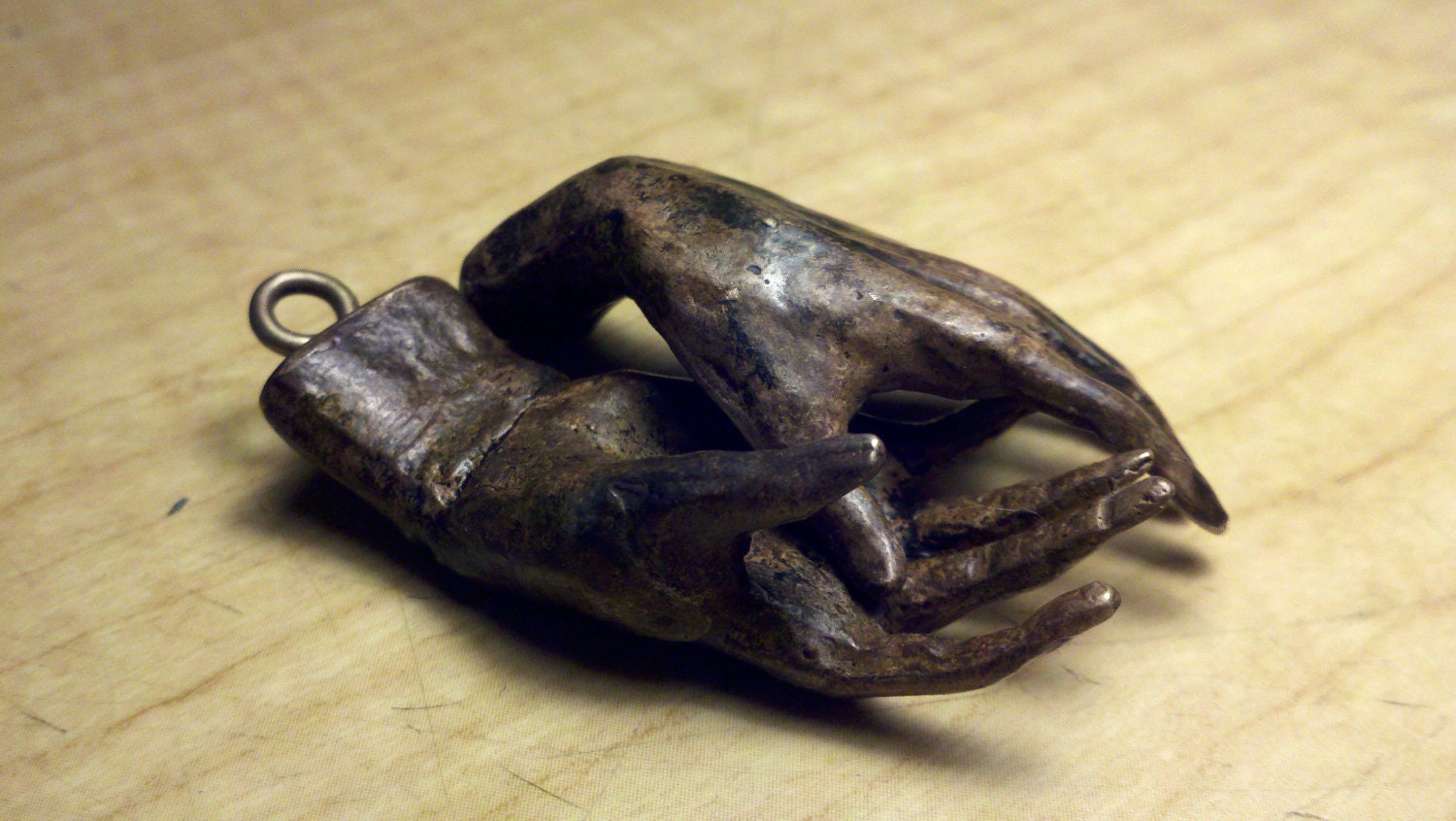 2" long small bronze hands with bronze screw eyes,