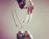 wire wrapped with garnet and aquamarine with ceramic white and blue bead