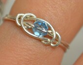 Aquamarine love knot ring sterling silver wire handmade with Swarovski crystal March birthstone Jewelry made to order