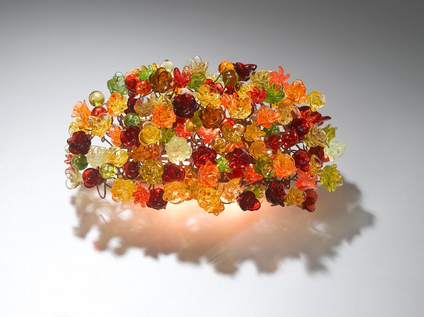 Wall lamp. Warm color shades of flowers.