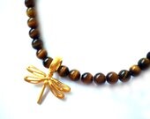 Elegant necklace with natural tigereye stone beads and a 22 carat gold plated dragonfly. Free Shipping Worldwide