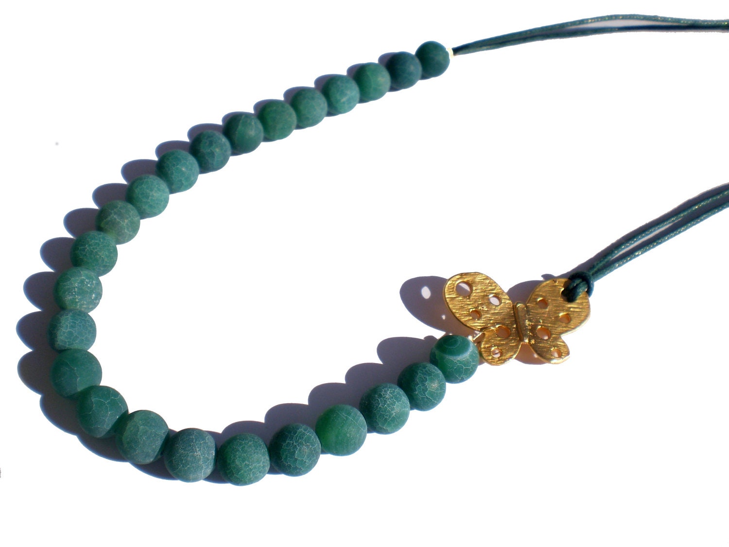 Handmade necklace made of dyed blue green fire agate beads and a gold plated butterfly FREE SHIPPING WORLDWIDE