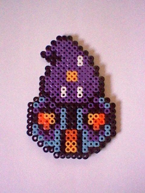 The Legend of Zelda Fortune Teller perler bead creation....melted beads with magnet on back
