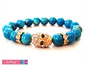 Gold Drizzled Turquoise Bead Bracelet with Crystal Skull Charm and Rondelles