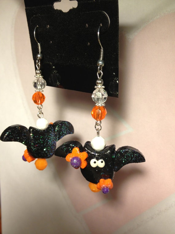 Adorable Halloween earring...cute bat with orange flowers...hypoallergic hooks - HeartbreakBoutique