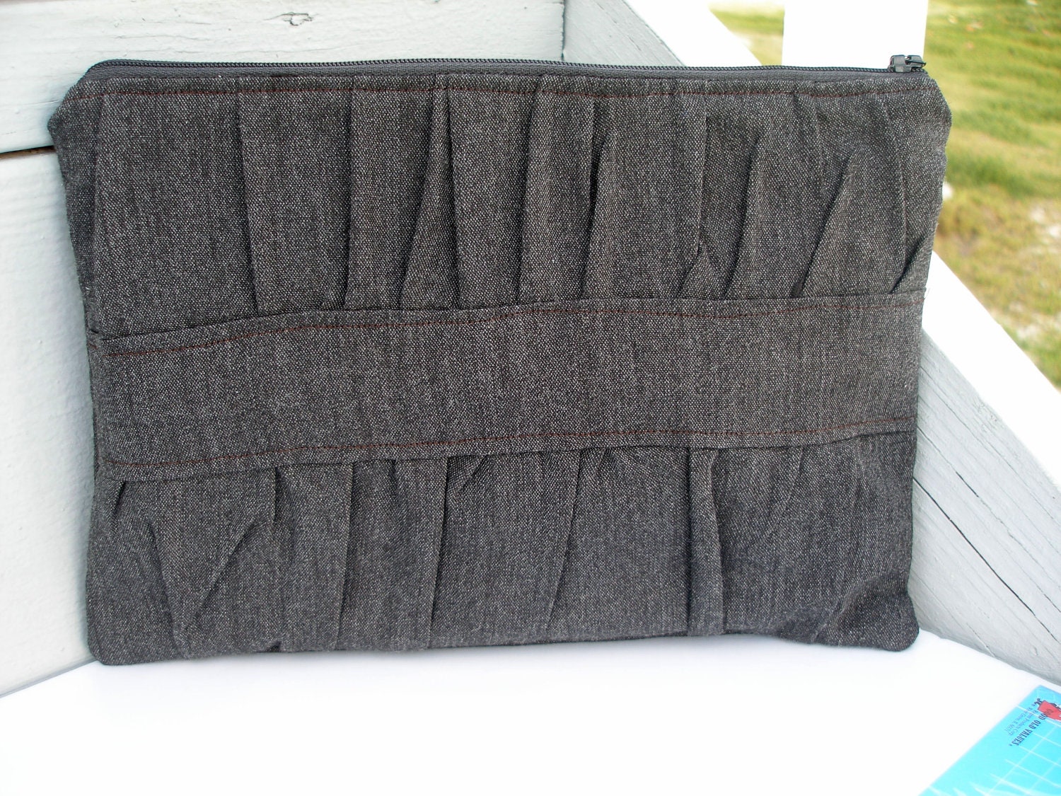 Pleat front zipper clutch bag, classic and neutral