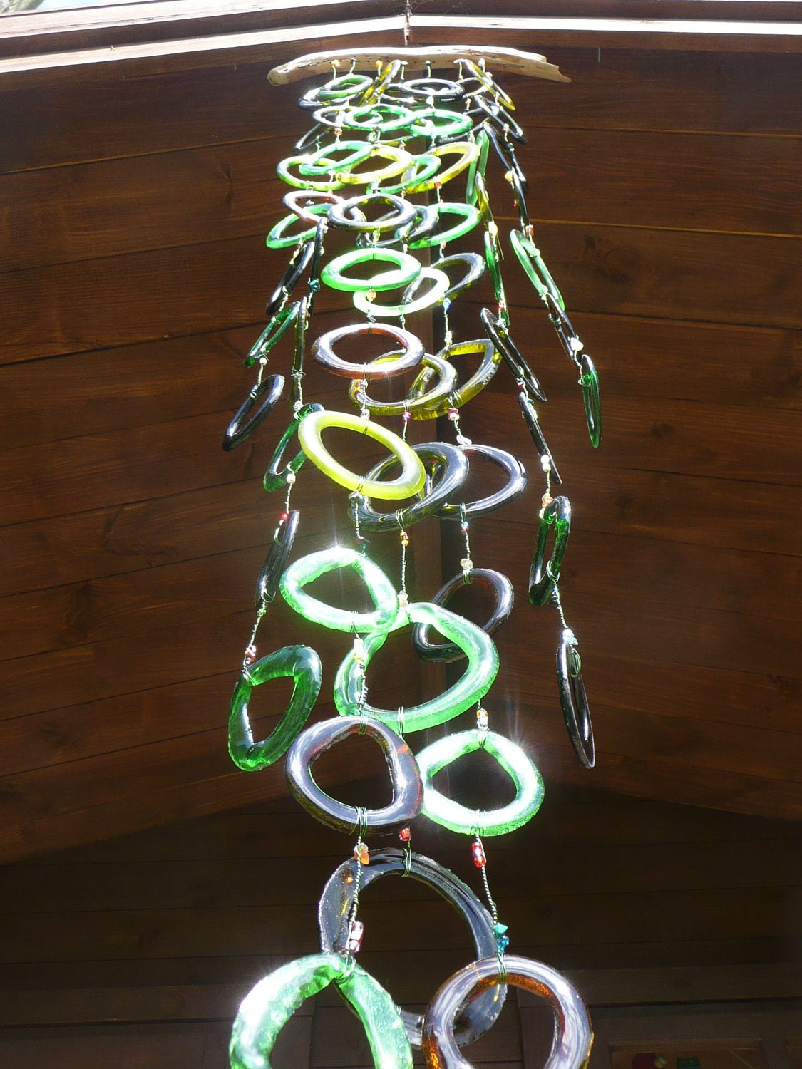 Cascade of light and colour made from recycled bottle glass