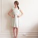 mod baby blue dress . wide BOW front .medium