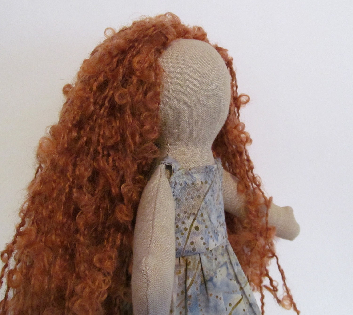 11" soft eco-friendly doll with light reddish brown curly hair