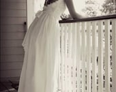 Beautiful low back wedding dress with lace capped sleeves and dreamy silk chiffon skirt, fitted to the waist