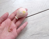 Felted accessory. Needle felted balloon brooch in Pink mixed multi-color,  clear pink water drop glass bead hangs at the bottom. NB8