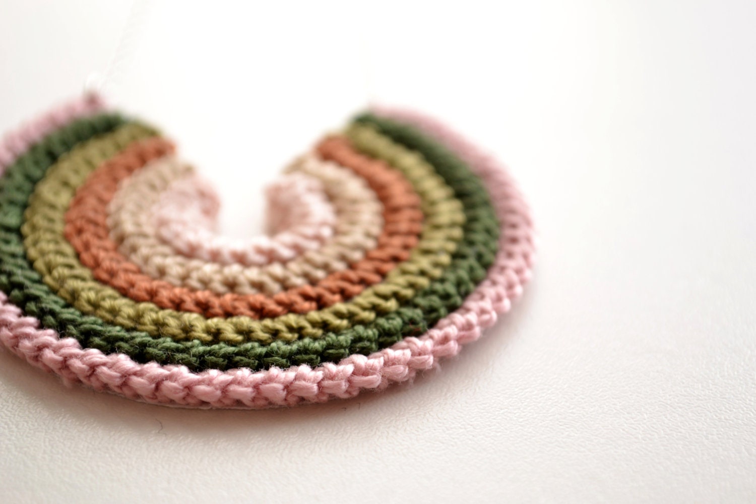 earth tones crochet circle necklace in neutral green, brown, pink colors, with sterling silver chain, boho style gift for her