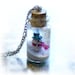 Bottle necklace, snowman and a winter wonderland scene, snow globe, bottle pendant