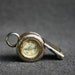 Antique whistle with a built-in compass. Never lose your way again.