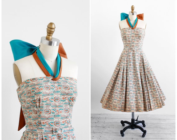 vintage 1950s dress / 50s dress / Blue and Tan Paisely Party Dress with Enormous Bow Halter Tie