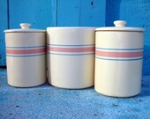 five-piece set of vintage crockery -- striped stoneware canisters with lids