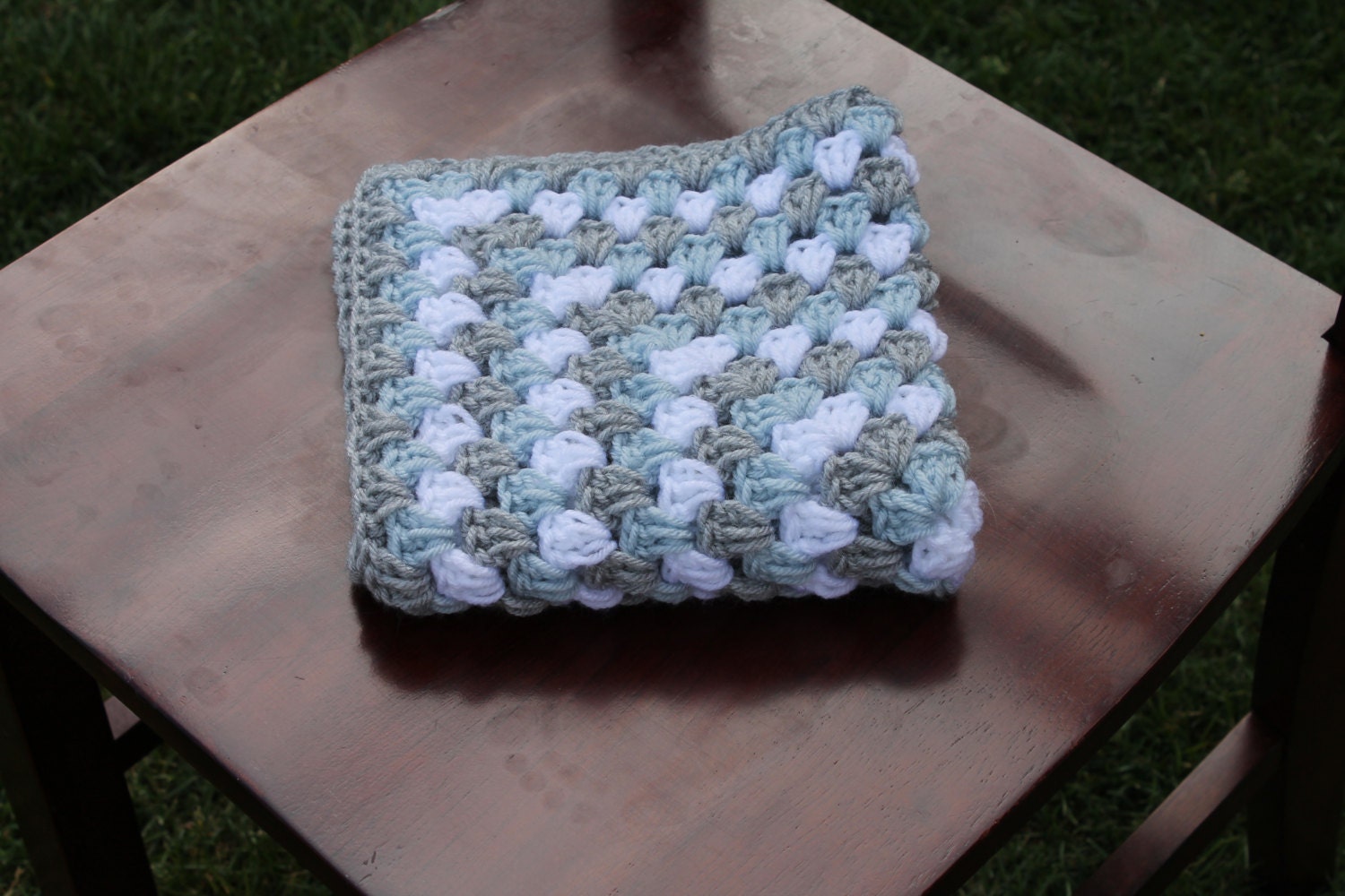 mini blanket in light blue and grey. mini granny square photography prop blanket