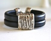Double strand Regaliz black leather bracelet with silver slide bead and silver hook clasp