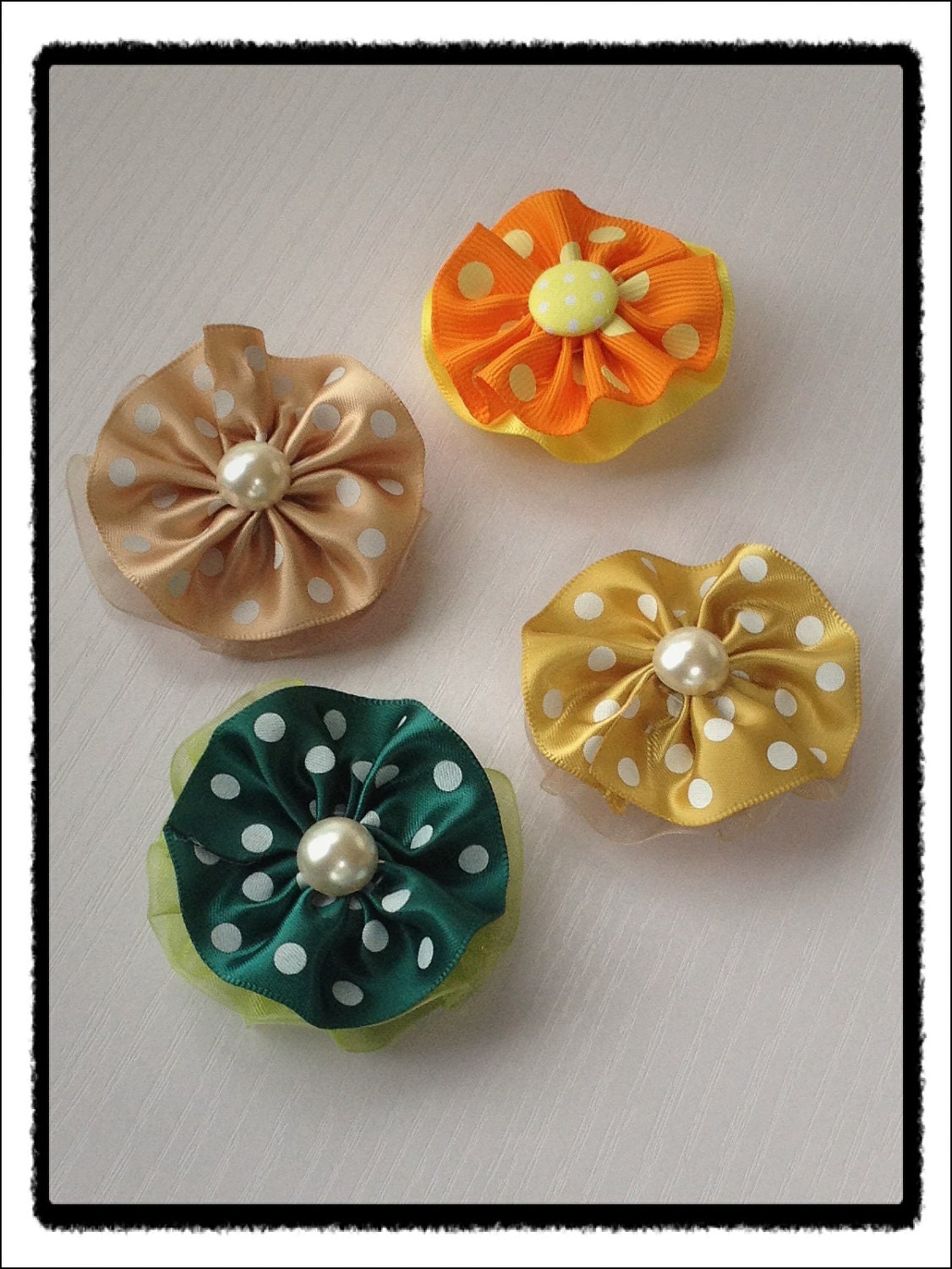 Polka dot sunflower hair clip.  You pick one.