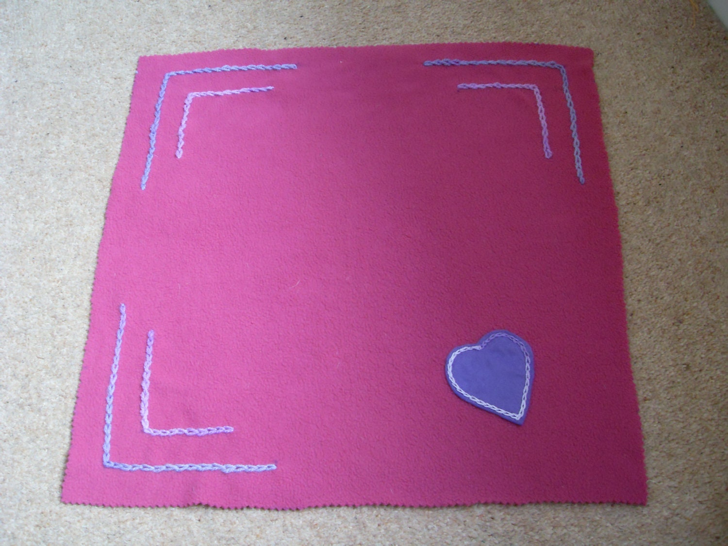 Baby girl hot pink fleece blanket with felt purple heart motif applique. ideal for prem baby, car seat, dolls blanket . Hand made