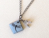 Dragonfly Necklace.  Pale Sky Blue on Black Porcelain Square.  Crystal Clear Glass Beads